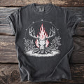 Dark gray t-shirt with a stag skull burning on split logs, flames rising through the antlers beneath an arc of runes.