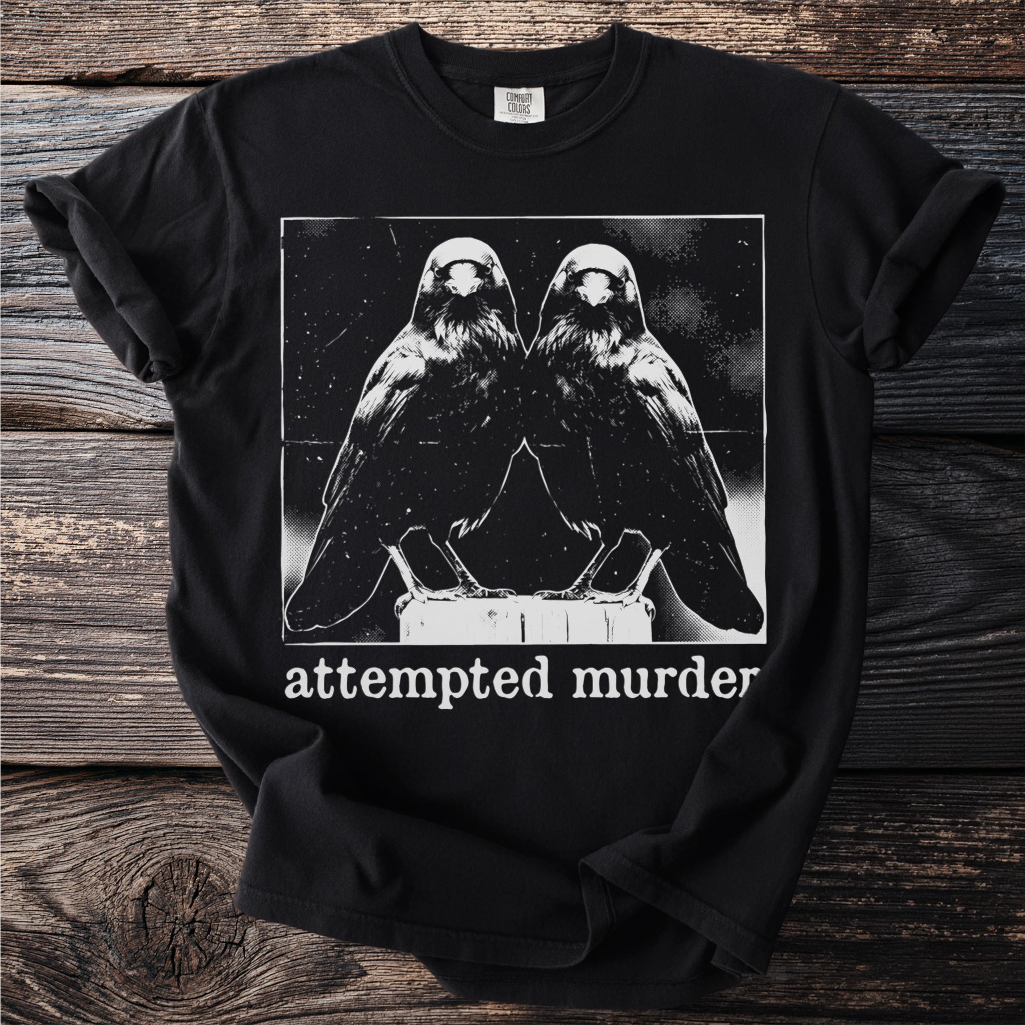 Black t-shirt with two crows and text "attempted murder."