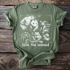 Green t-shirt with distressed graphic of opossum, moth, rat, raccoon, frog, spider, snake, and snail.