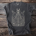 Dark gray t-shirt showing Morrigan with open wings, flying ravens, crescent moon, and skulls.