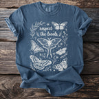 Blue t-shirt with white line art design of butterflies and the text "respect the locals".