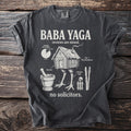 T-shirt with "Baba Yaga reviews are mixed" and illustrations of her hut on chicken legs.