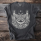 Dark t-shirt with a moth, crescent moon, candles, and floral design.