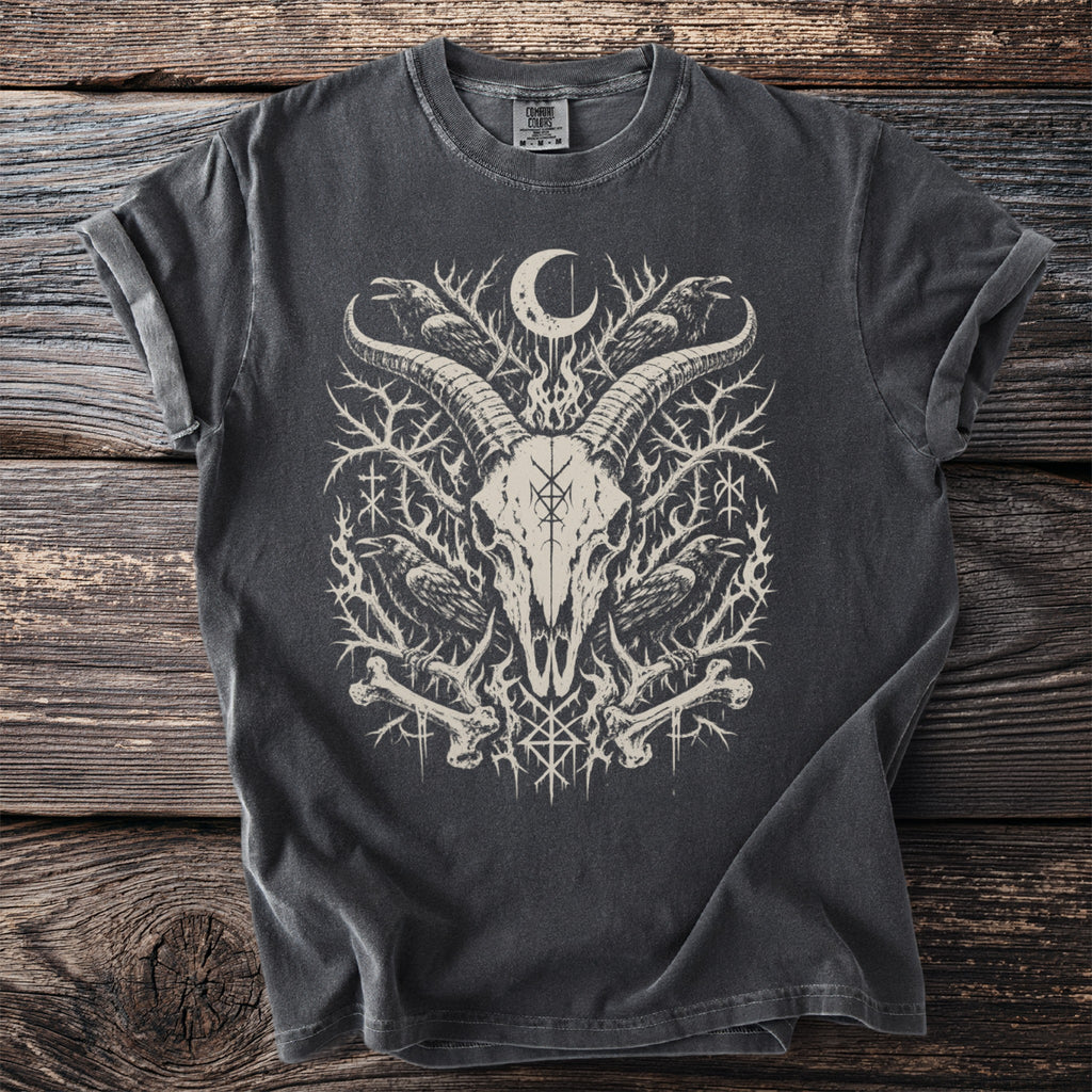 Dark grey t-shirt featuring a white graphic of a goat skull with ravens, bones, and runes.