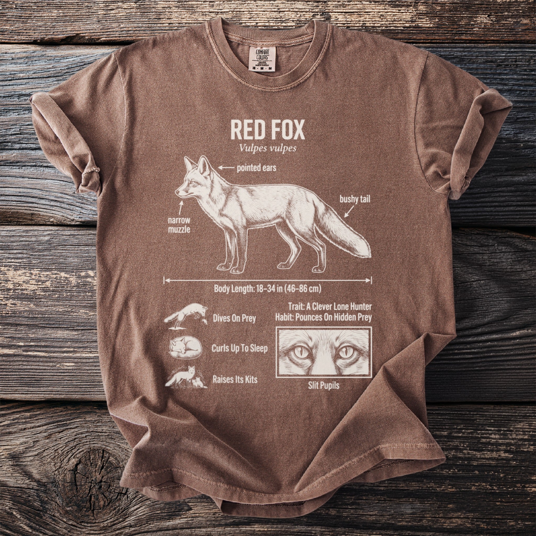 Brown shirt with detailed red fox scientific illustration and text labels.