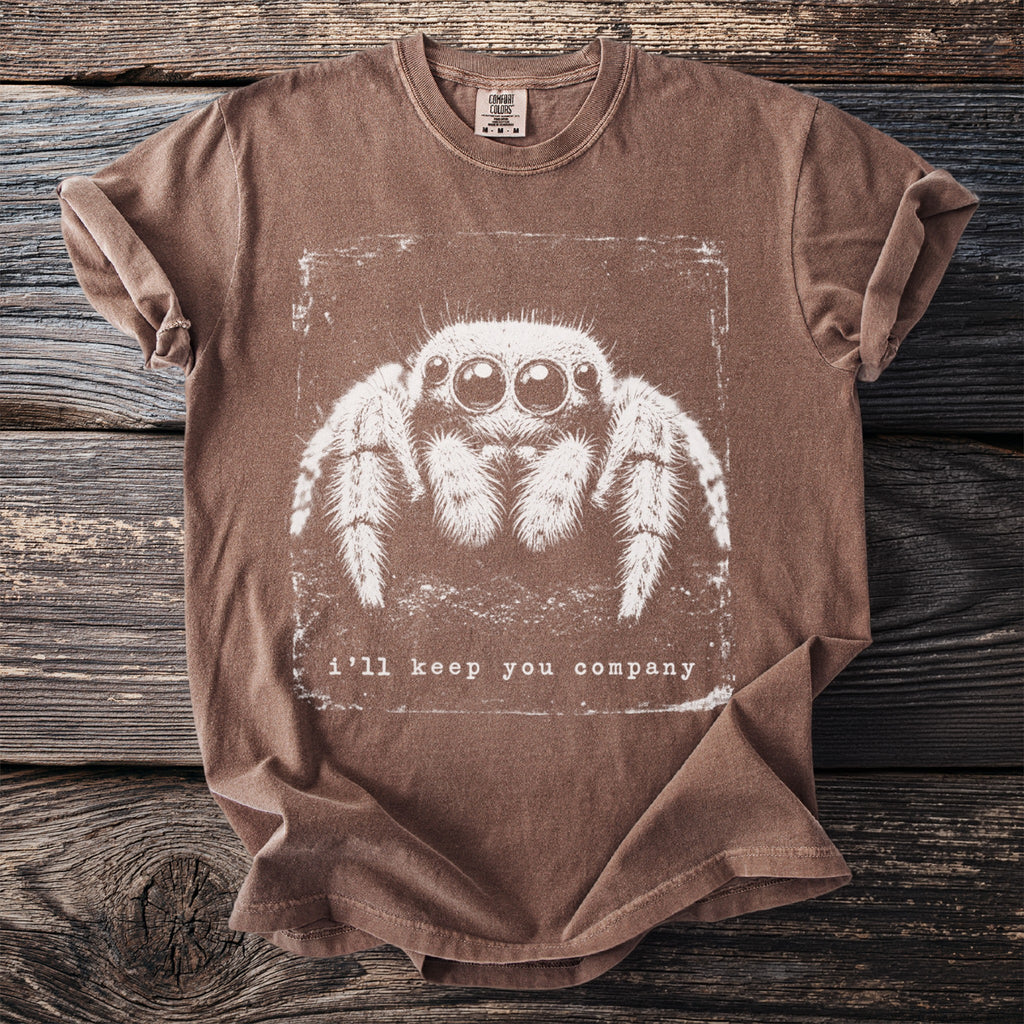 Brown t-shirt with a white graphic of a jumping spider and "i'll keep you company" text.