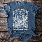 Blue t-shirt with text "All plants are edible. Some only once."