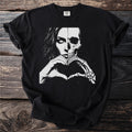 Black t-shirt with graphic of half woman's face and half skull making heart shape.