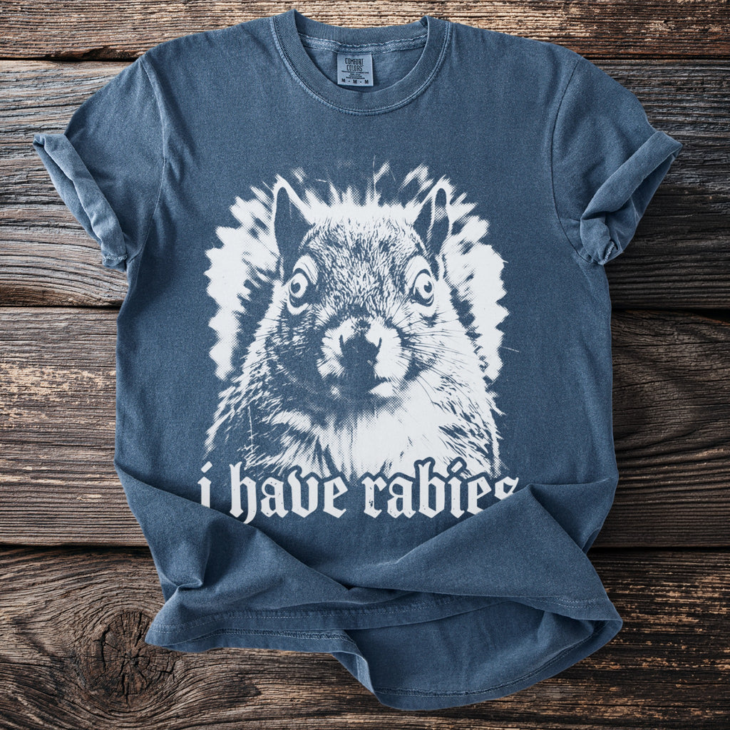 Blue t-shirt with a distressed graphic of a squirrel and the text "i have rabies."