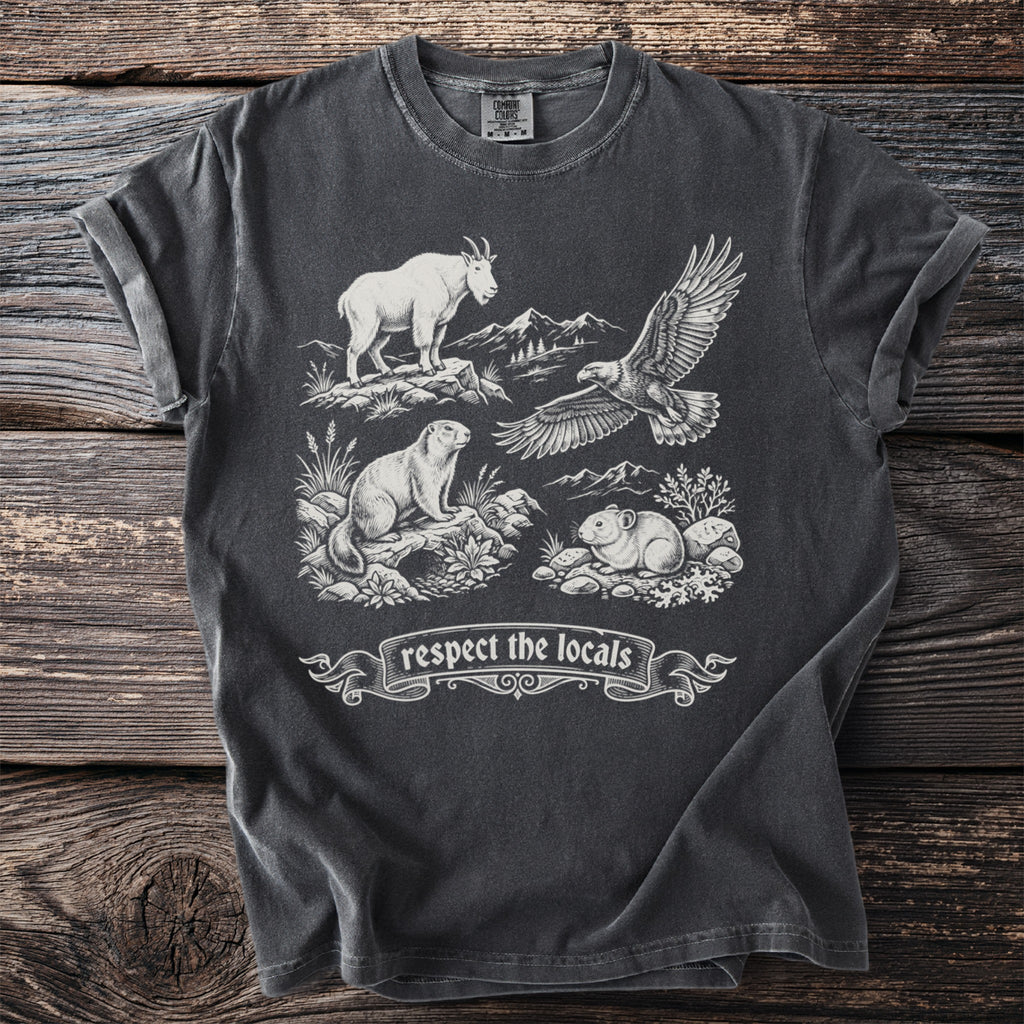 Dark gray t-shirt with a mountain goat, eagle, marmot, and pika graphic and "respect the locals" text.
