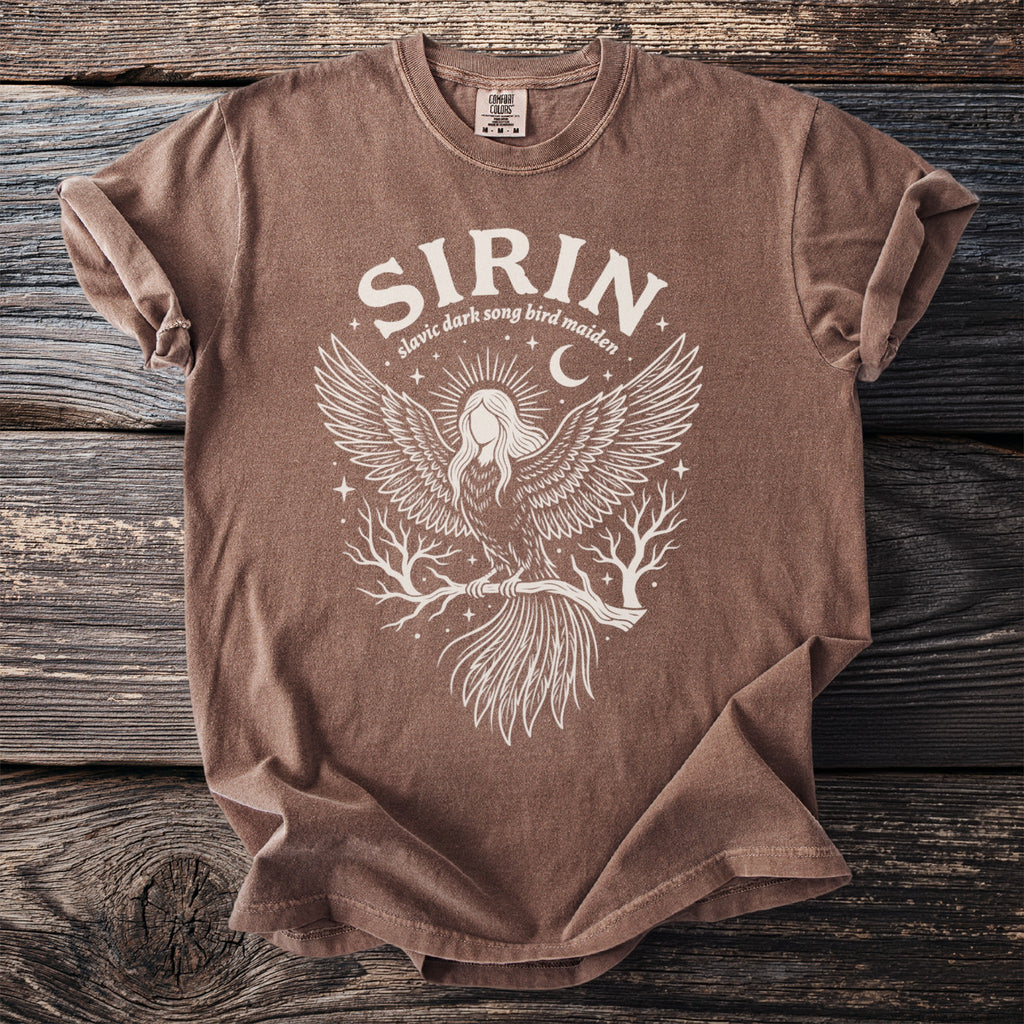 Brown t-shirt with white graphic of a winged female figure, birds, and text "SIRIN slavic dark song bird maiden".
