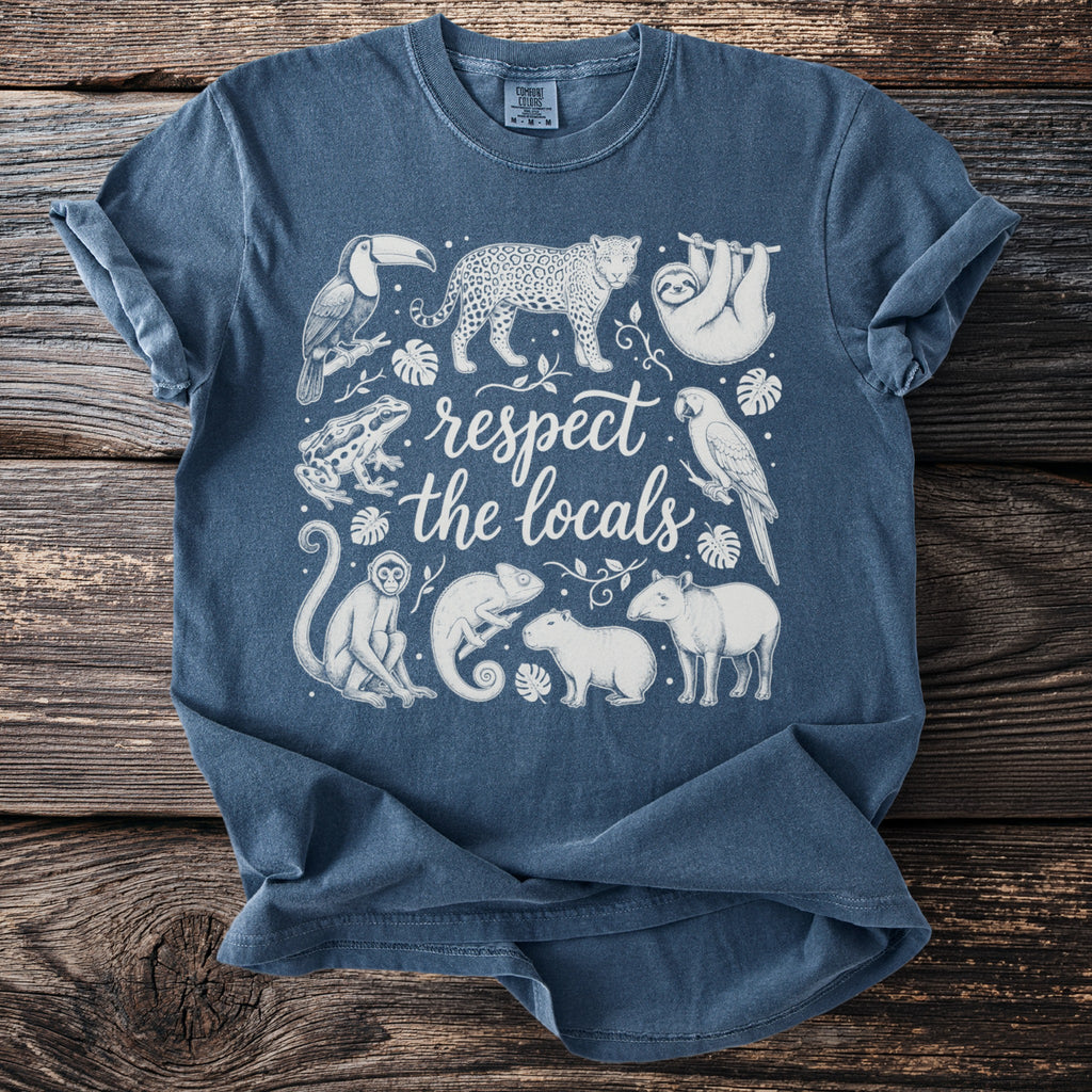 Blue t-shirt with line drawing of jungle animals and text "respect the locals".