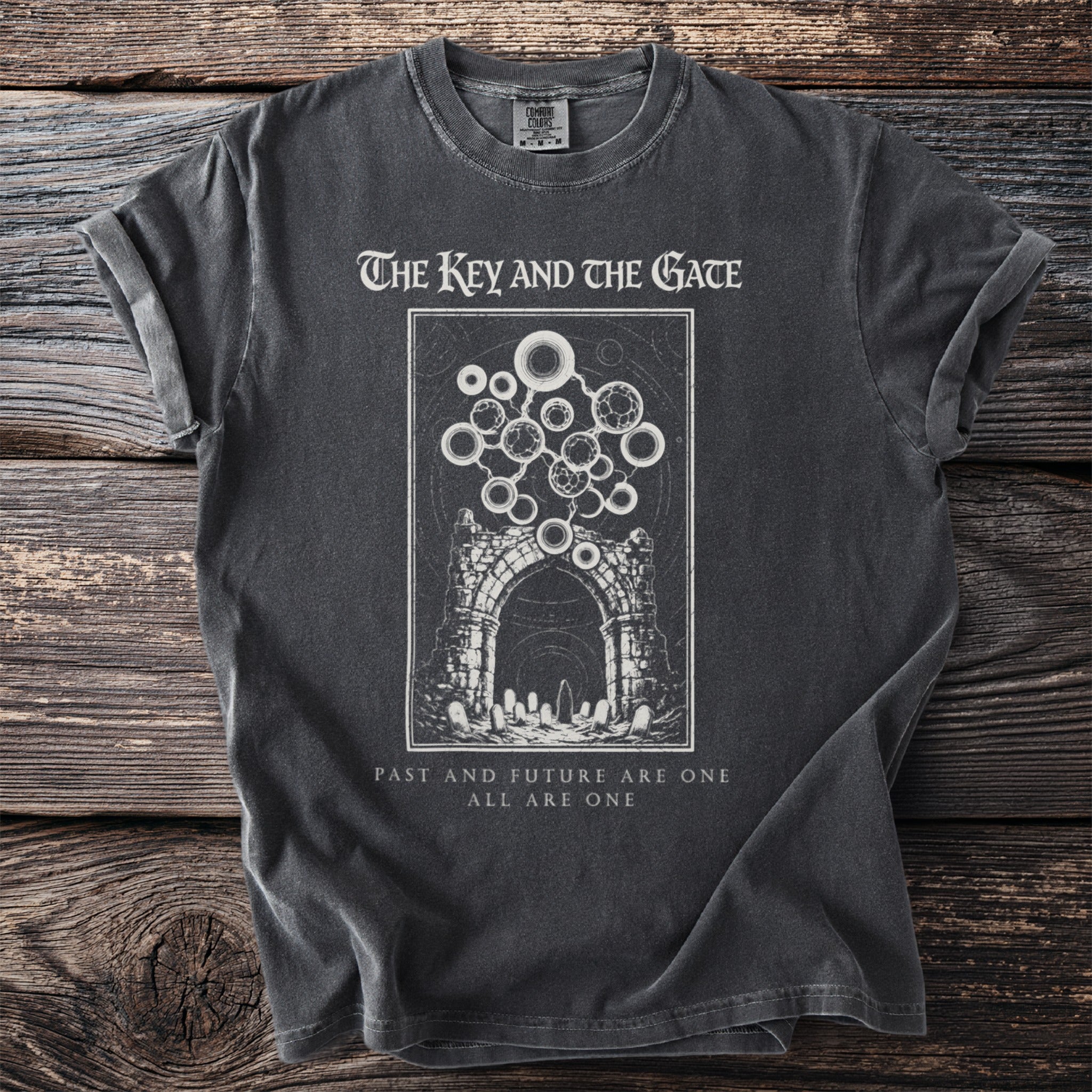 Dark t-shirt with graphic: The Key and the Gate, archway, and text.