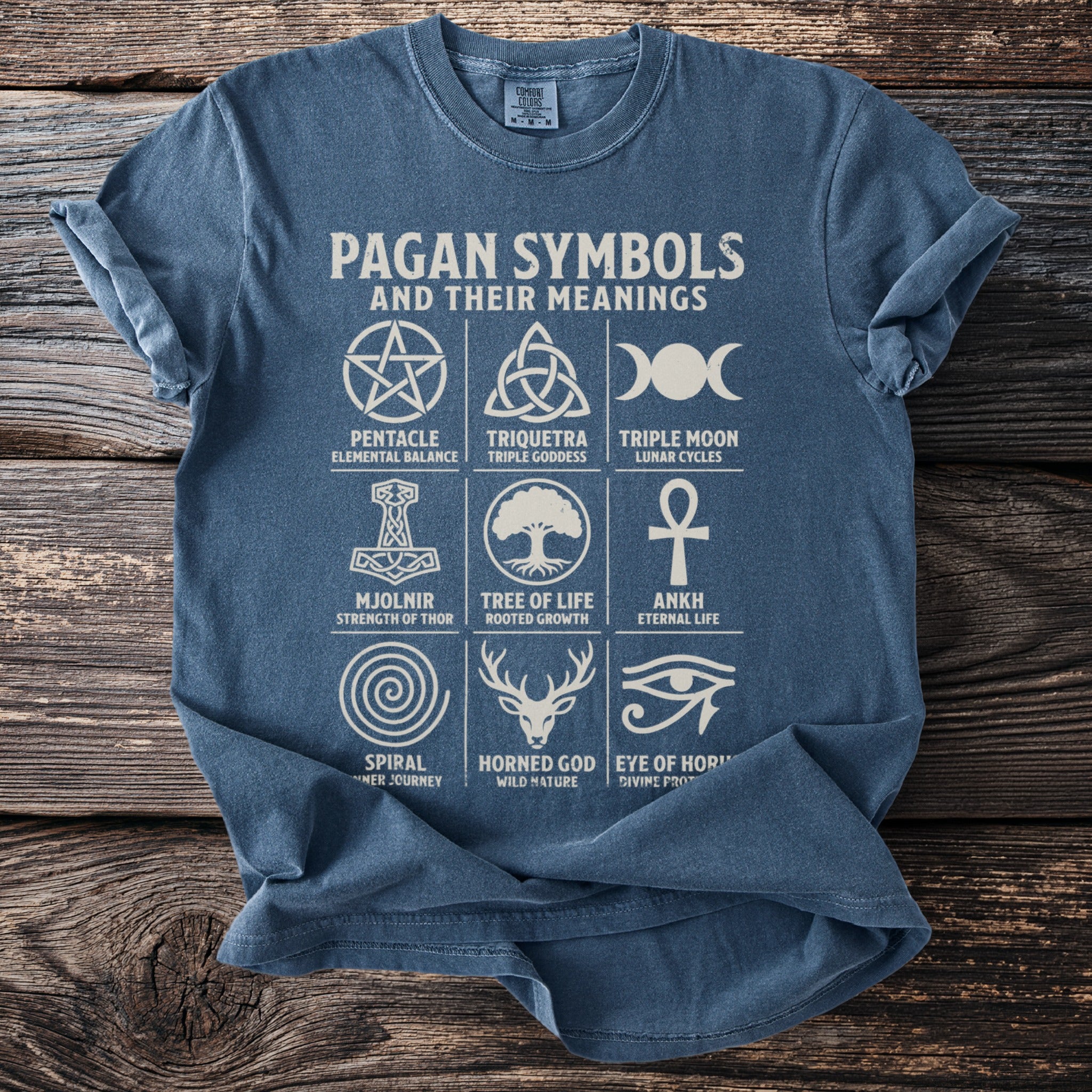 Blue t-shirt with "Pagan Symbols and their Meanings" title and nine symbols.