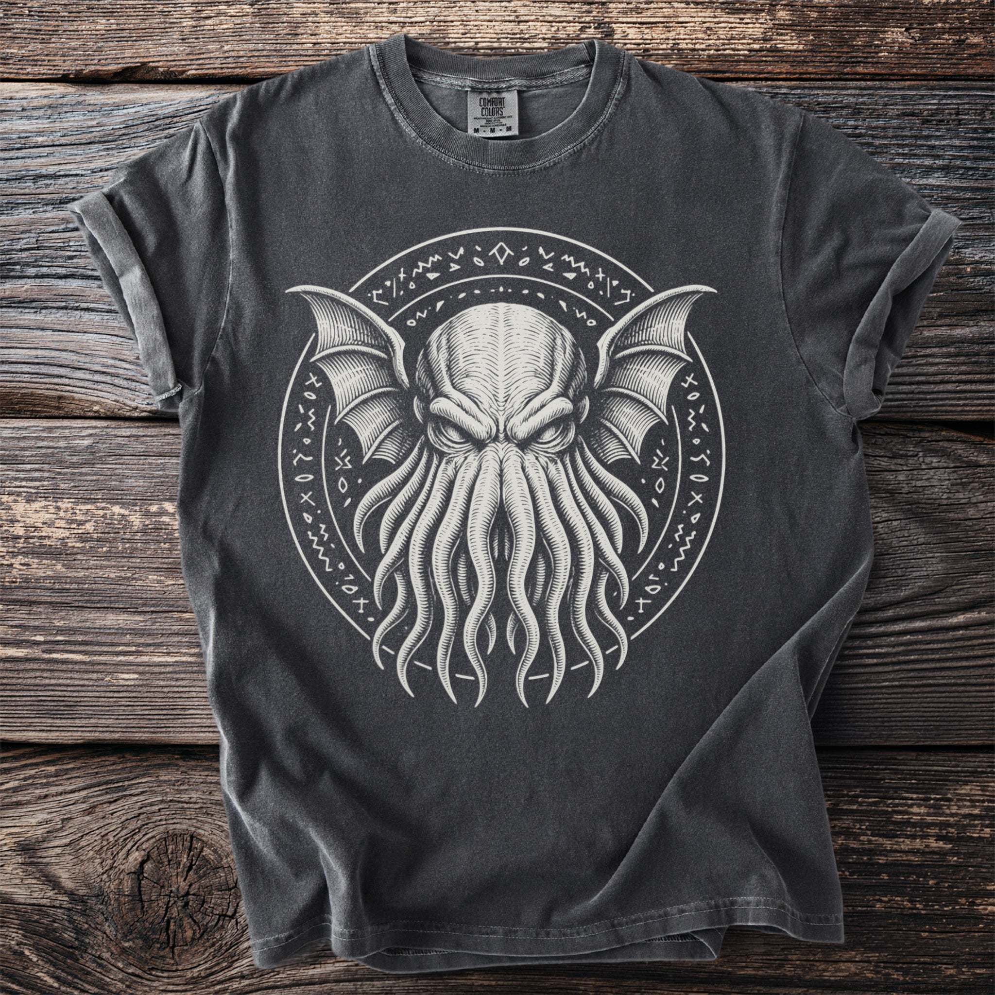 Dark grey t-shirt with a tentacled creature graphic and runes in a circle.