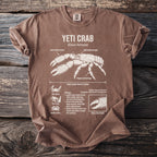 Brown t-shirt featuring a diagram of a yeti crab with labeled body parts and facts.