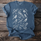 Blue t-shirt featuring a white line art print of various birds and feathers.