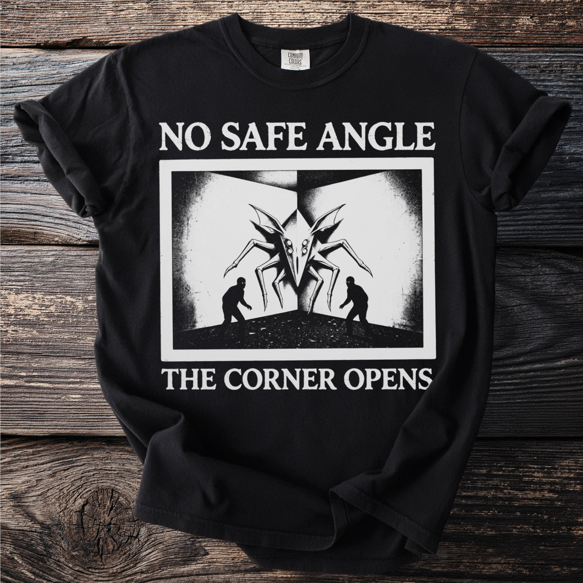 Black t-shirt with "NO SAFE ANGLE THE CORNER OPENS" and spider-like creature graphic.