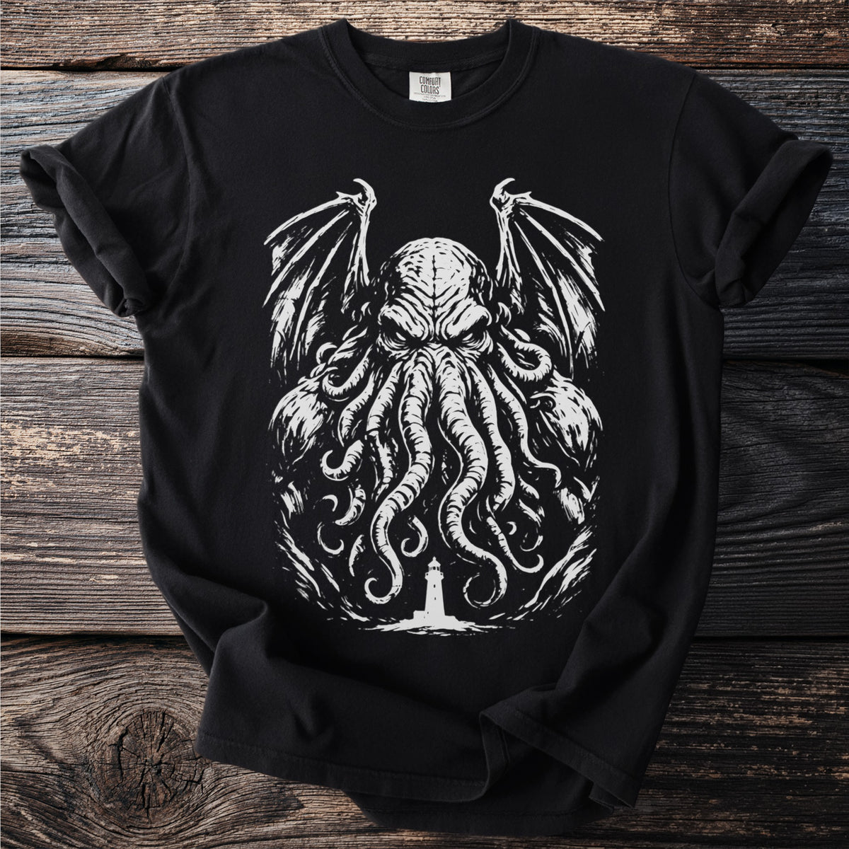 Black t-shirt with a white graphic of a tentacled creature and a lighthouse.