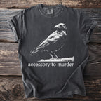 Dark gray t-shirt with a white crow graphic and "accessory to murder" text.