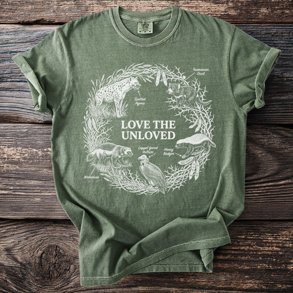 Green T shirt with Love the Unloved and five misunderstood animals in white line art.