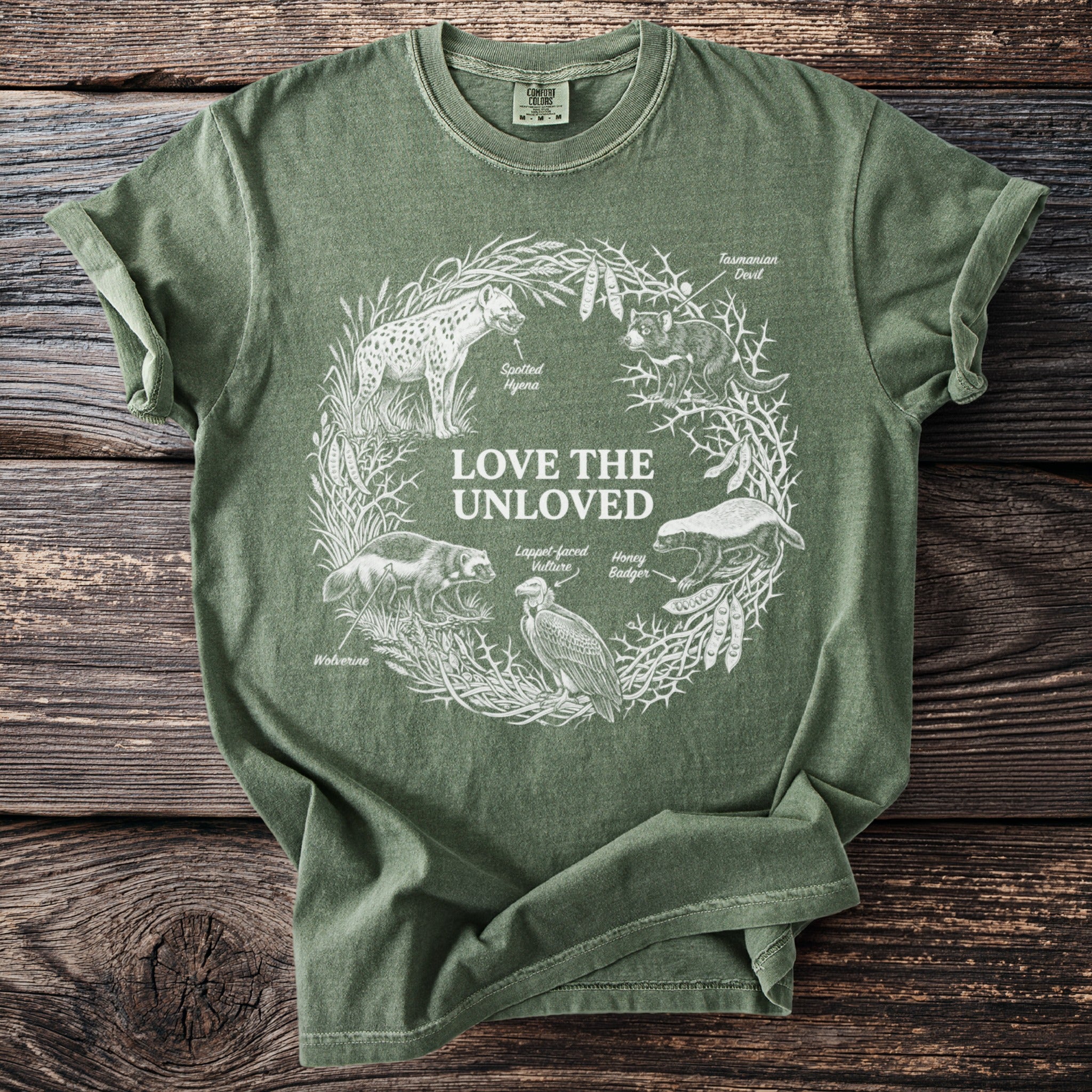 Green T shirt with Love the Unloved and five misunderstood animals in white line art.