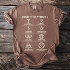 Brown t-shirt with white "PROTECTION SYMBOLS" text and six protection symbols.