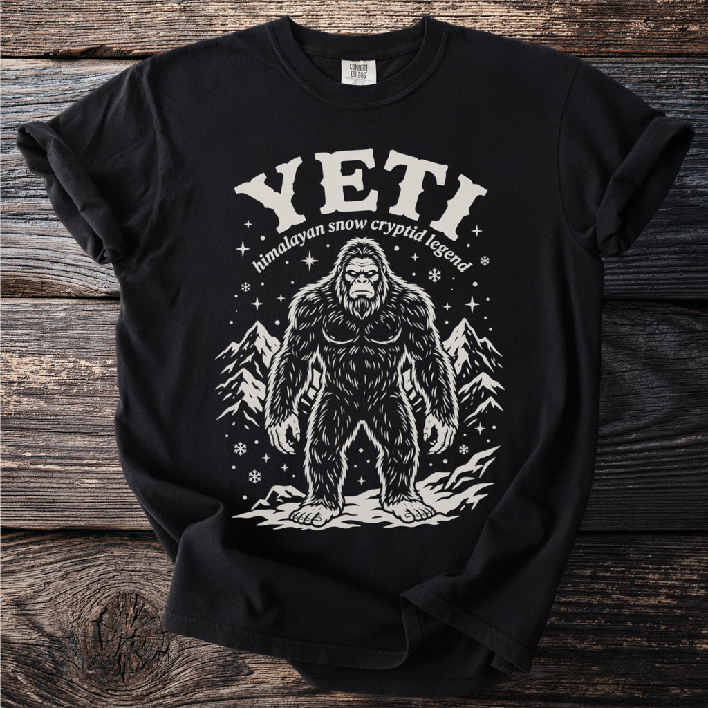 Black t-shirt featuring a Bigfoot-like cryptid illustration with "YETI Himalayan snow" text.