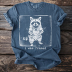 T-shirt with white graphic of raccoon and text "i was framed"