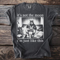 Dark grey t-shirt with graphic: "it's not the moon i'm just like this".