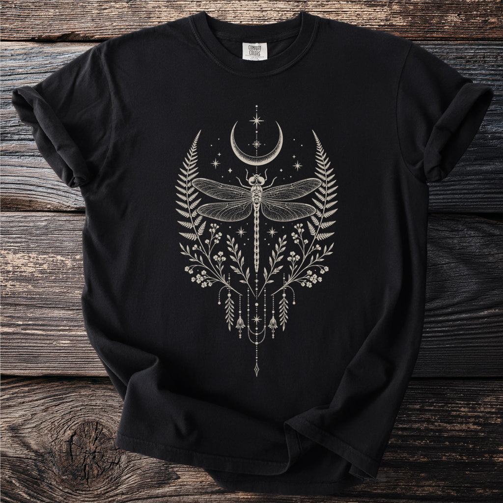 Black t-shirt with cream dragonfly, crescent moon, and celestial floral design.