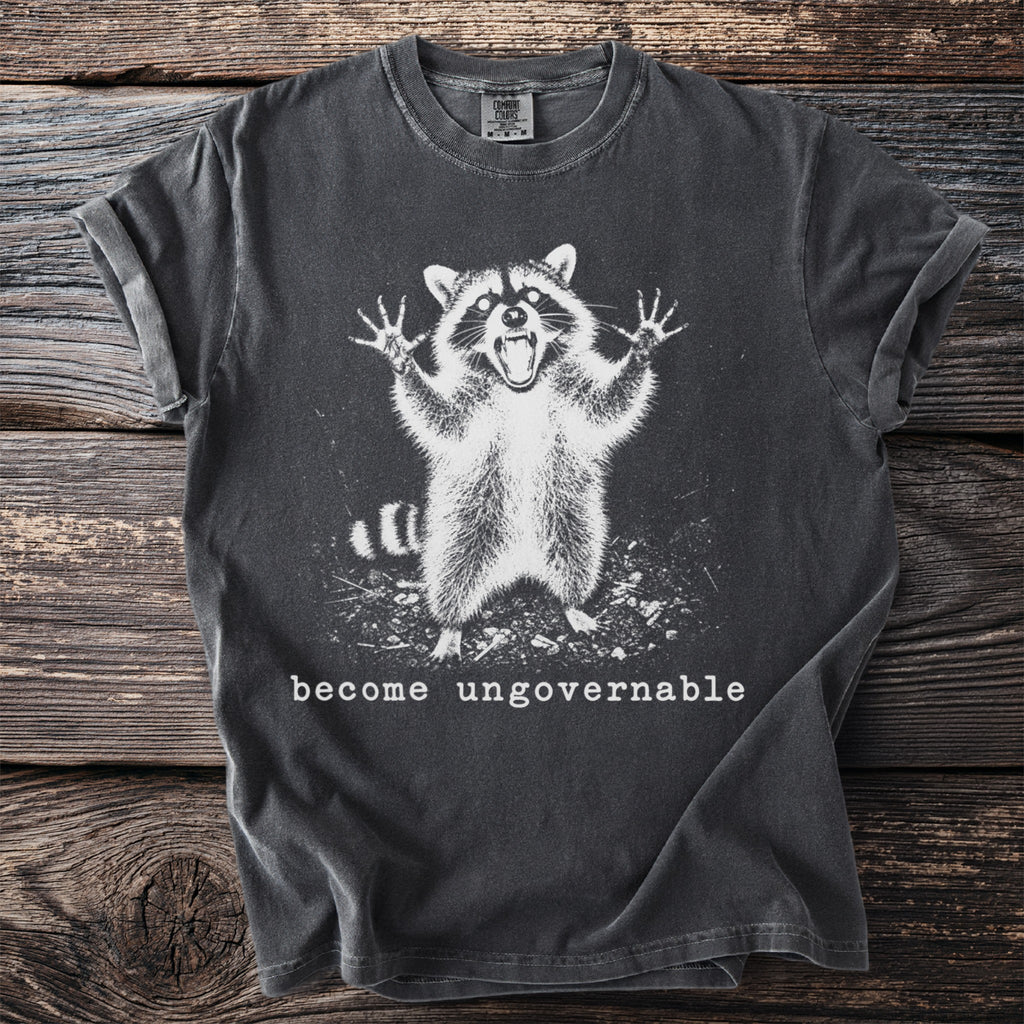 Dark grey t-shirt with a graphic of an angry raccoon and text "become ungovernable".