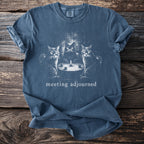Blue t-shirt with three cats at a table with a candle and text "meeting adjourned".
