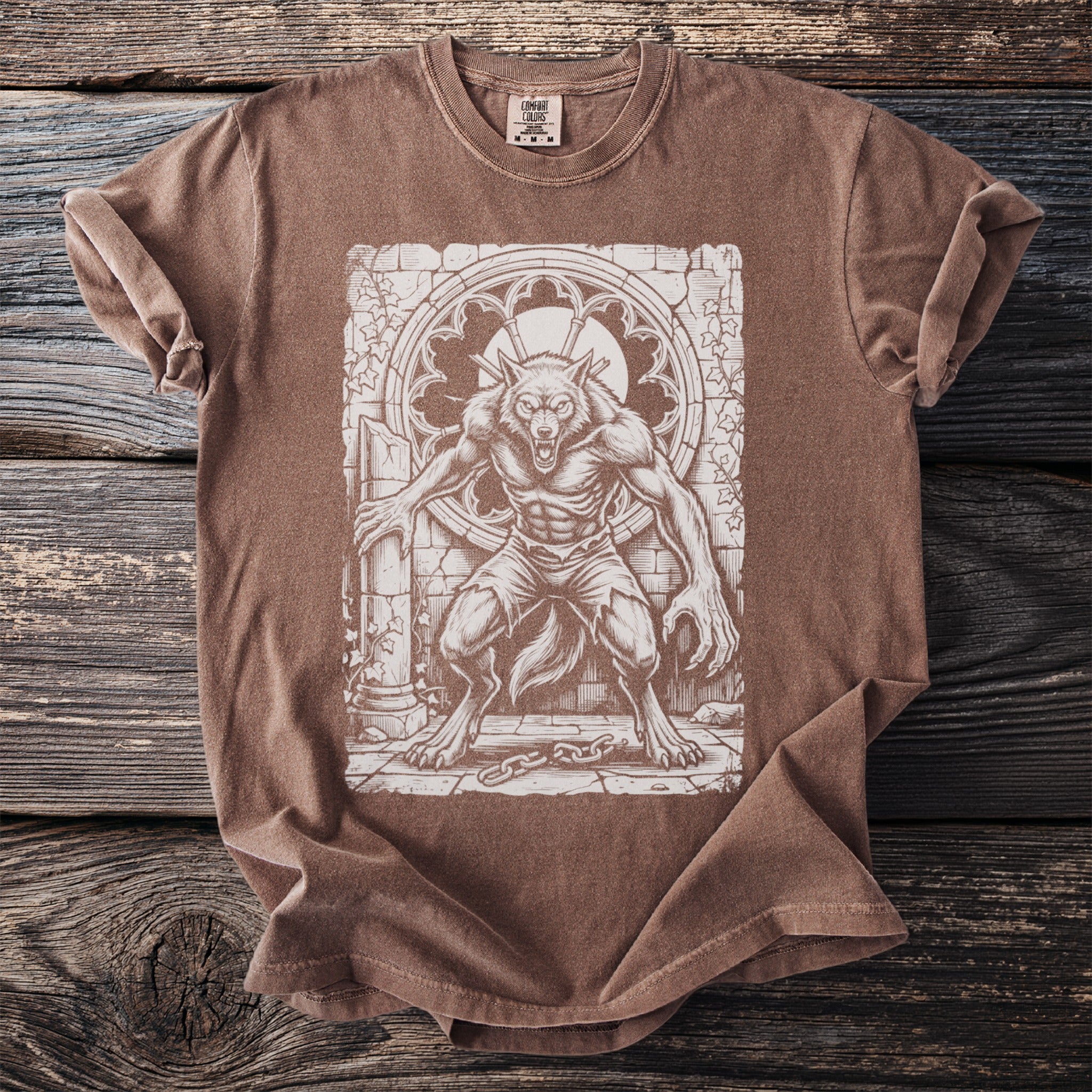 Brown t-shirt with a werewolf graphic in a gothic window and stone setting.