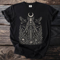 Black t-shirt with a gothic illustration of a queen among ravens, thorny branches, and skulls.