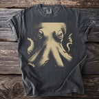 Graphic t-shirt with a close-up etching of an octopus on a dark background.
