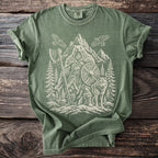 Green t-shirt with a Viking-inspired graphic of a bear, wolf, and forest.
