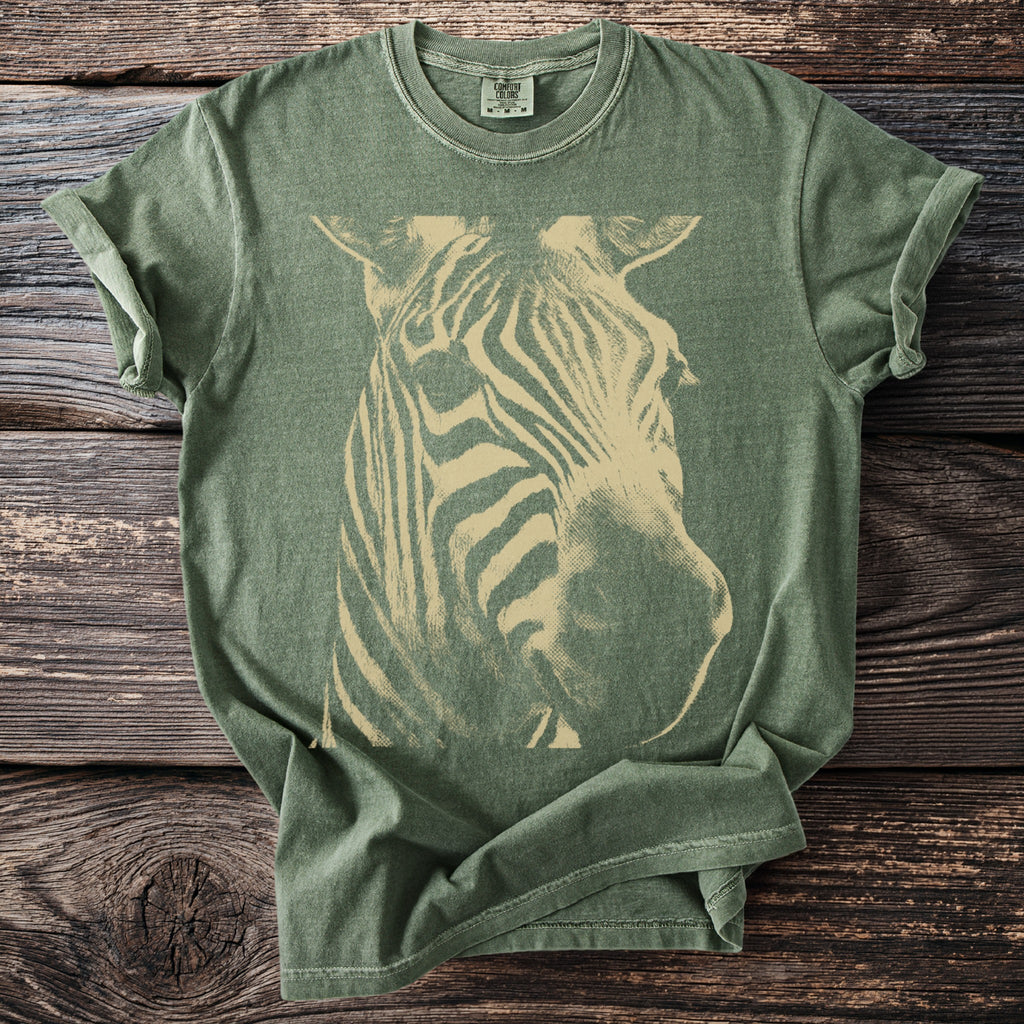 Green t-shirt with a vintage cream zebra head graphic and Comfort Colors label.