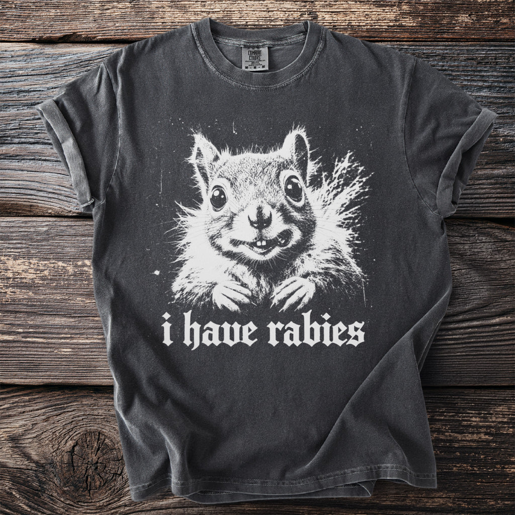 Dark grey t-shirt with a white print of a squirrel and the text "i have rabies".