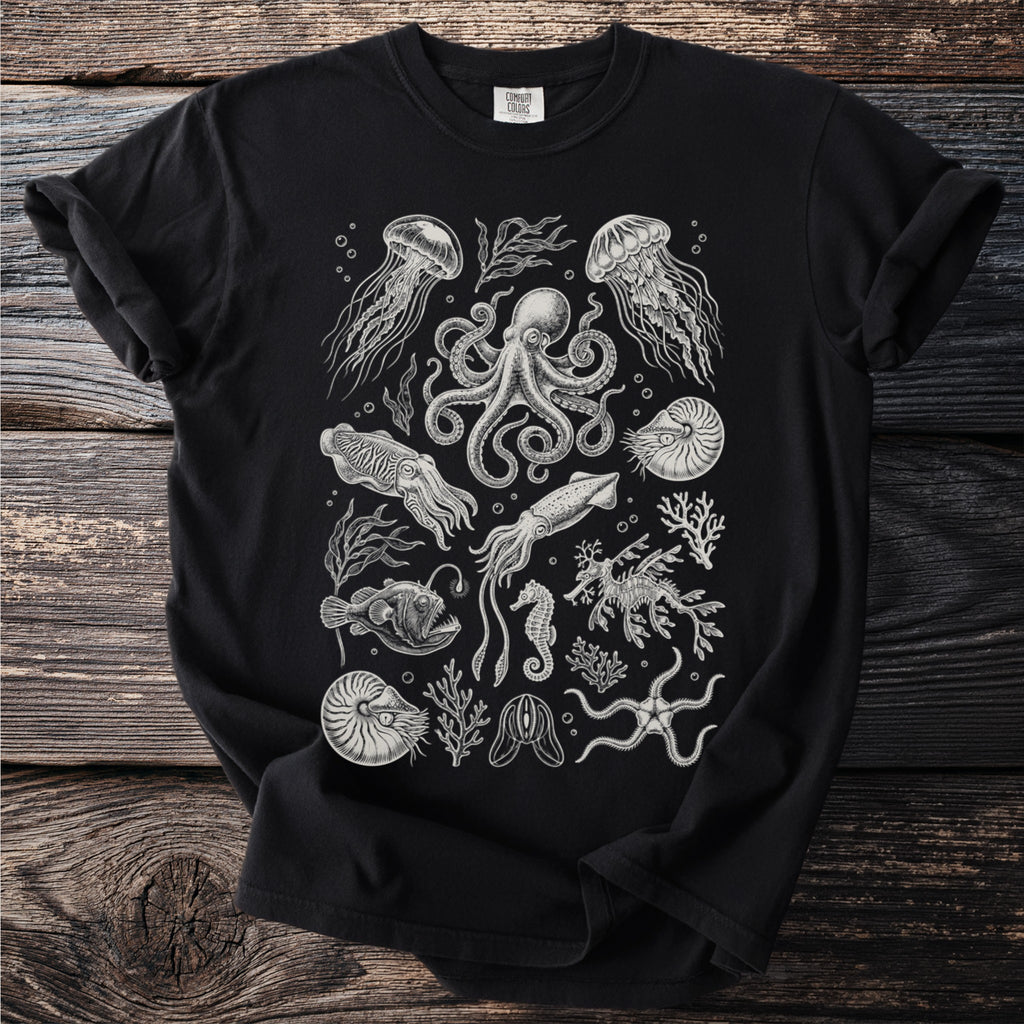 Black t-shirt with a detailed vintage-style illustration of various sea creatures.