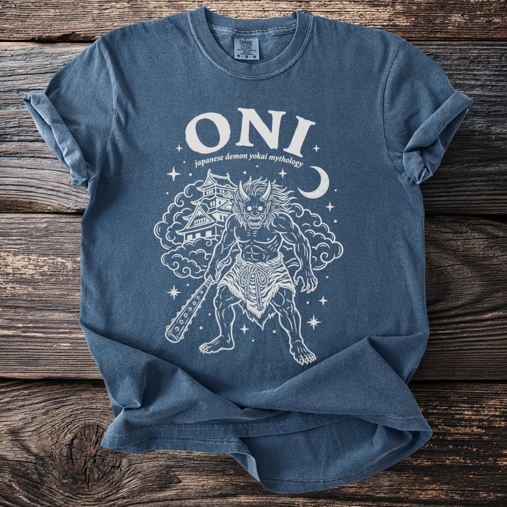Blue t-shirt featuring a graphic of an Oni demon with castle and moon.