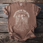 Brown shirt featuring Phantom of the Opera graphic with text and opera house scene.