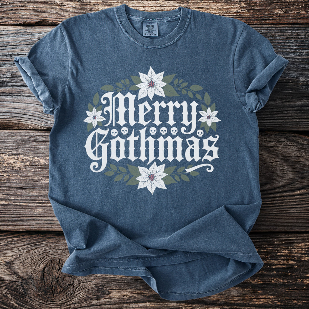 Blue shirt with "Merry Gothmas" text, poinsettias, and skulls.
