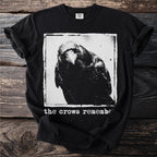 Black t-shirt with a distressed crow graphic and white text "the crows remembe".