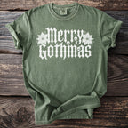 Green t-shirt with white "Merry Gothmas" text, skulls, and poinsettias.