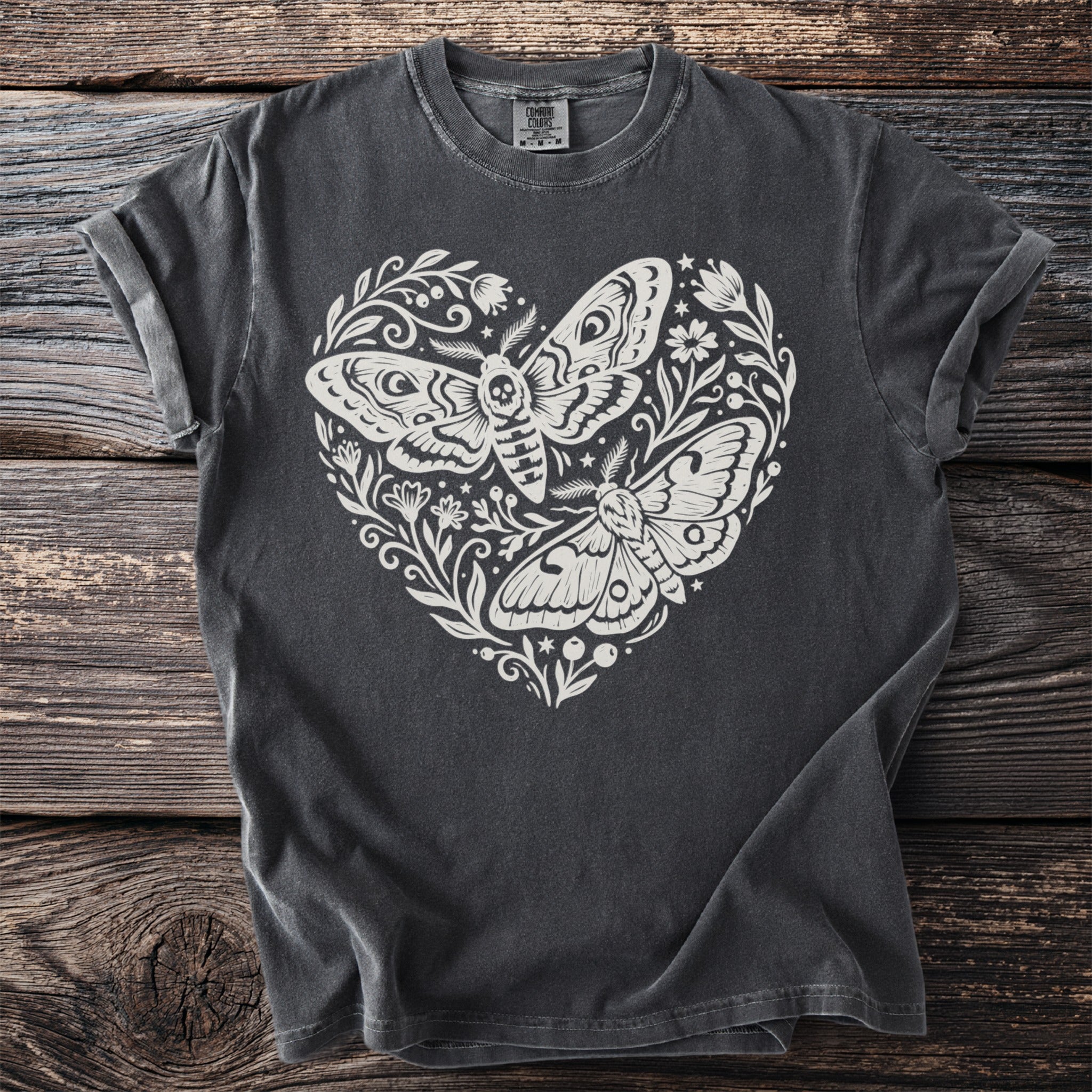 Dark grey t-shirt with white heart-shaped moth and floral print.