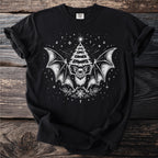 Black t-shirt with white bat, Christmas tree, and snowflake graphic.