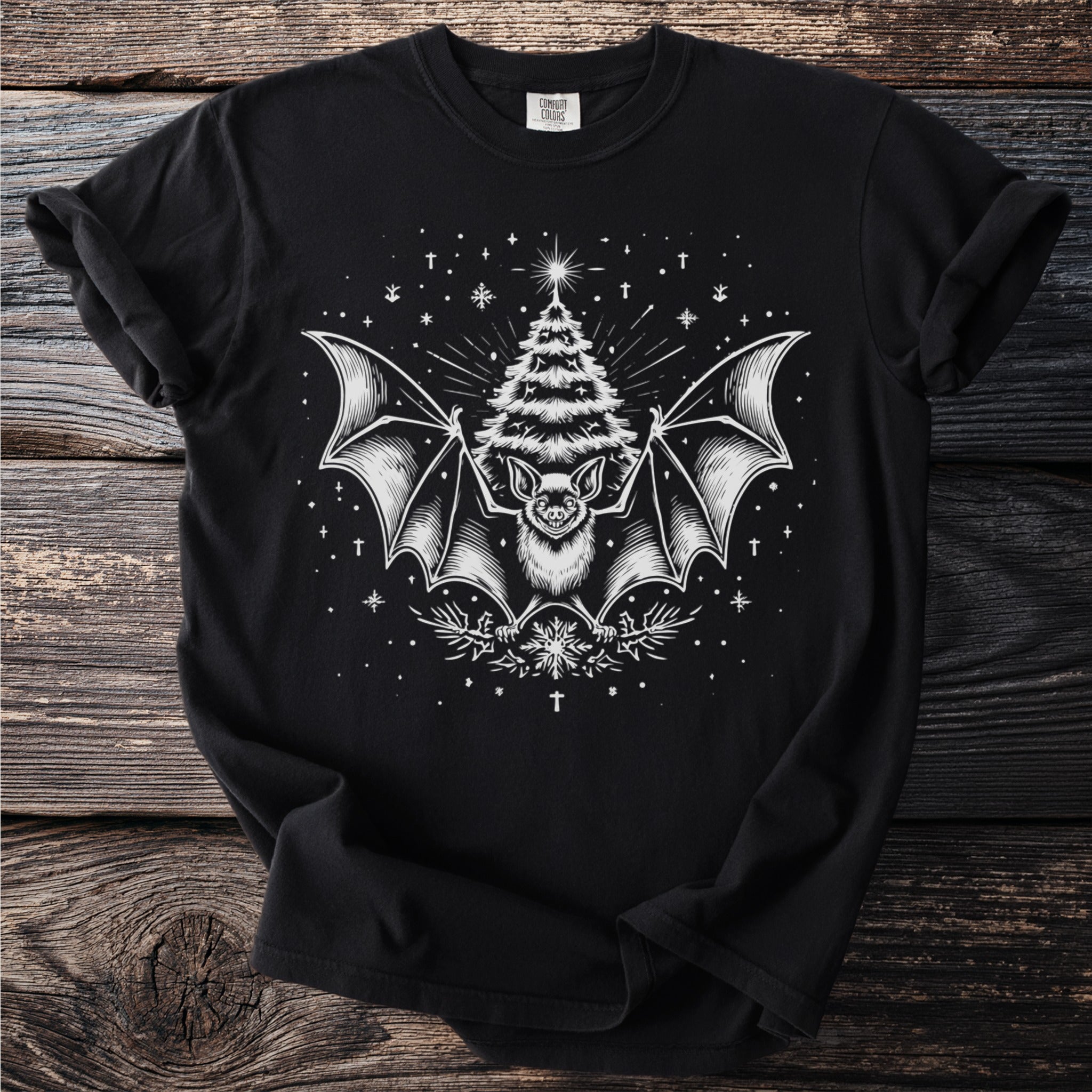 Black t-shirt with white bat, Christmas tree, and snowflake graphic.