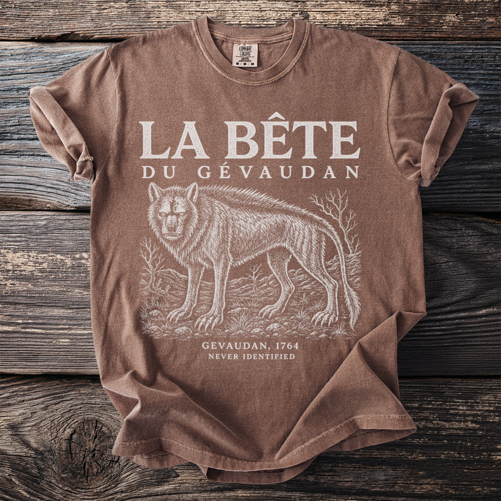 Brown t-shirt with "LA BÊTE DU GÉVAUDAN" text and a wolf illustration.