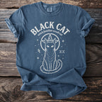 Blue t-shirt with "Black Cat witch familiar occult cat" and a cat symbol.